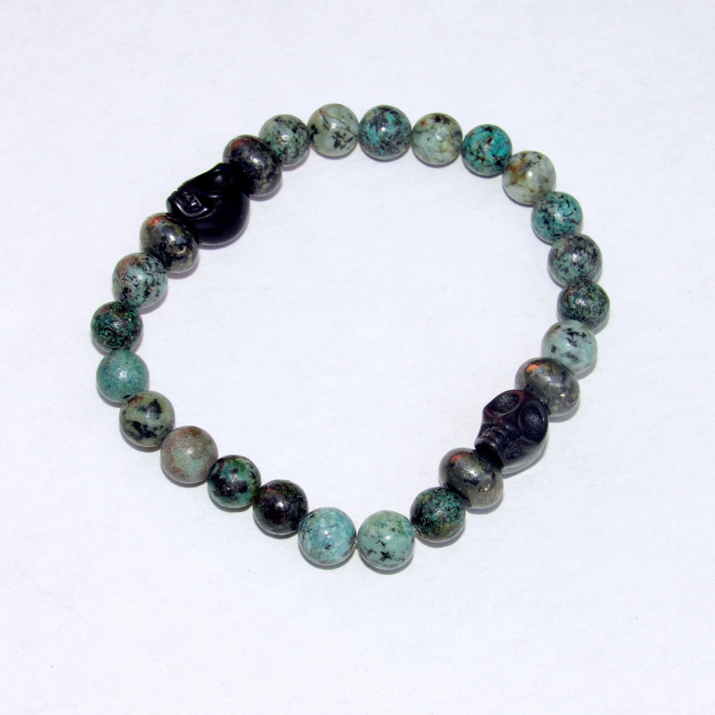 African Turquoise, Pyrite, and Howlite Skull Men’s Stretch Bracelet