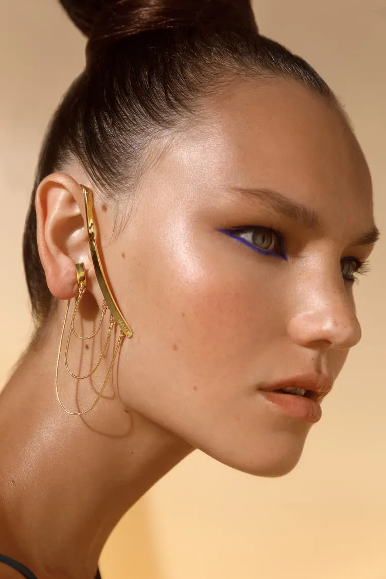 gold ear-cuff with draped chain